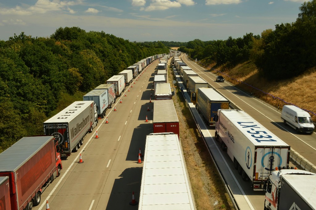 HGV and commercial trucks queued on a multi-lane motorway